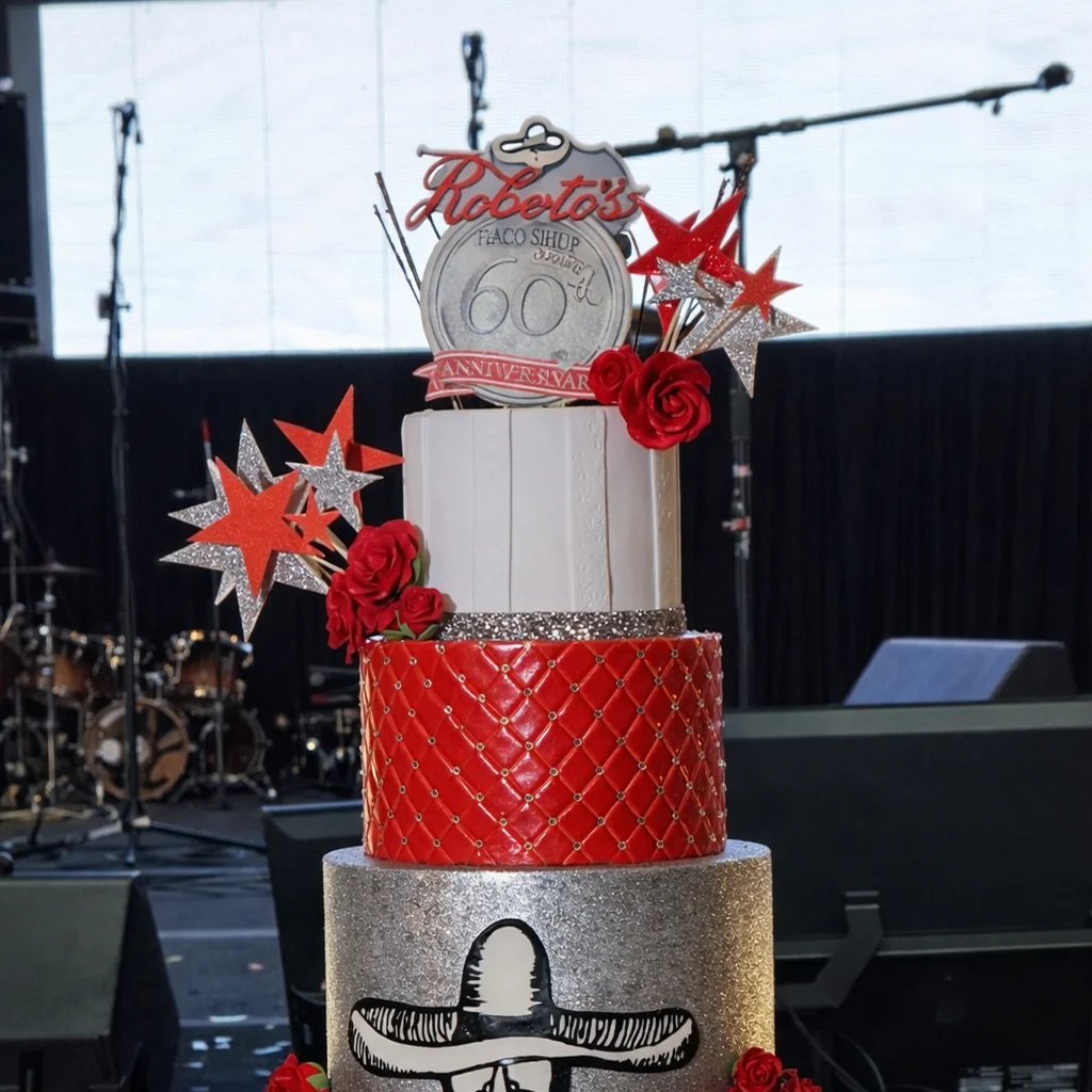 Celebration cake display at Roberto’s Point Loma event